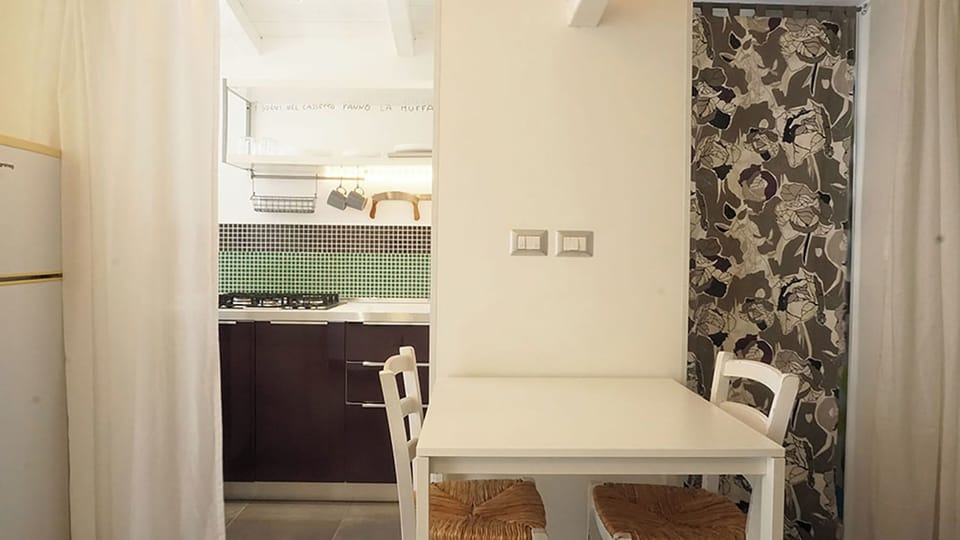 Apartment, Pool View | Living area | 35-inch TV with digital channels
