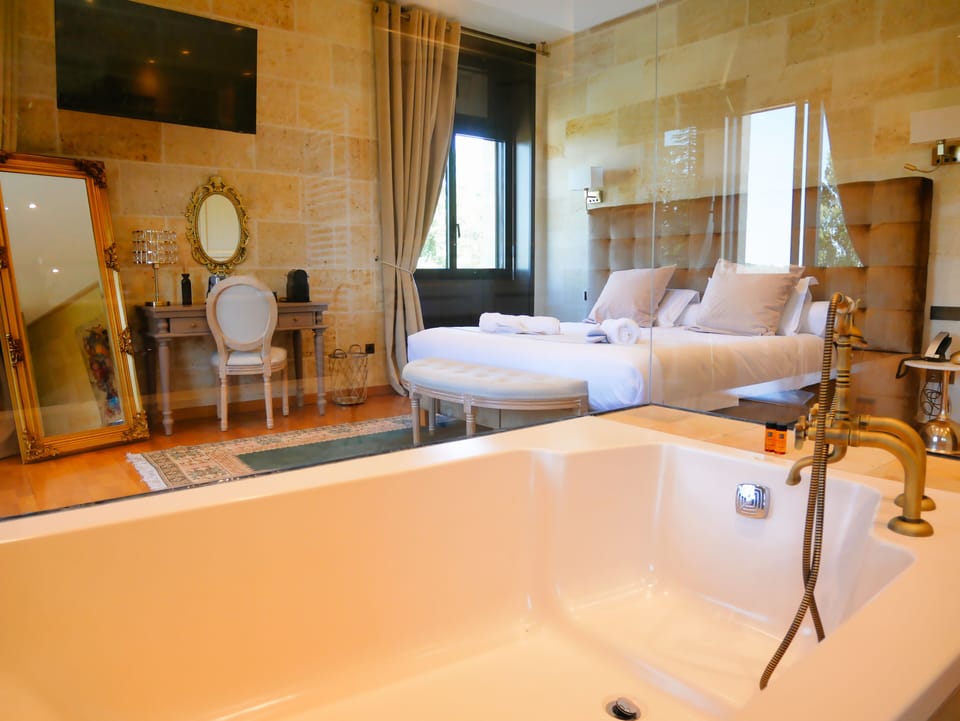 Honeymoon Double Room | Bathroom | Hair dryer, slippers, towels