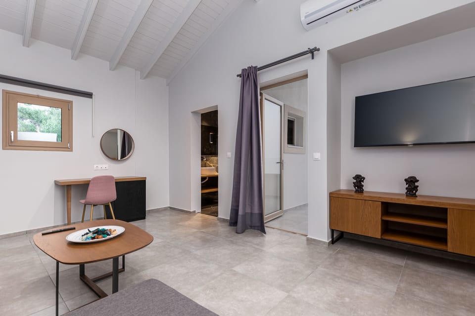 Suite, Sea View | Living area | Flat-screen TV