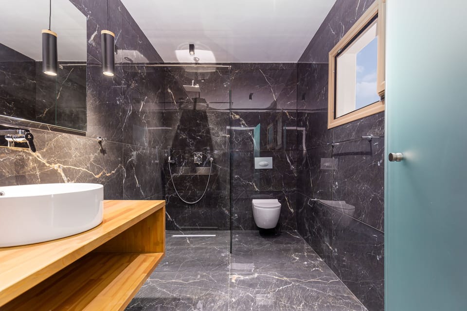 Suite, Sea View | Bathroom | Shower, free toiletries, hair dryer, slippers