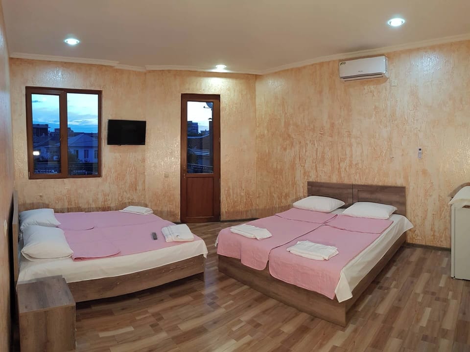Basic Quadruple Room | Premium bedding, blackout drapes, soundproofing, iron/ironing board