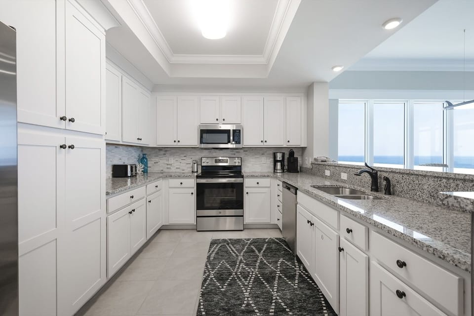 Condo, 4 Bedrooms | Private kitchen | Coffee/tea maker, fridge, oven