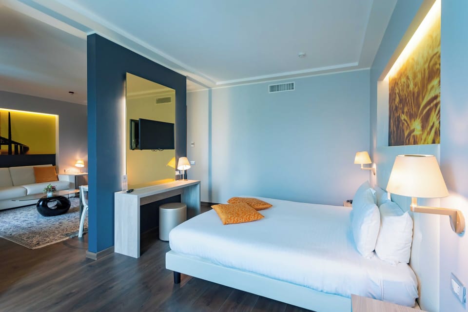 Family Quadruple Room | Premium bedding, minibar, in-room safe, desk