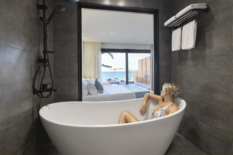 Separate tub and shower, hydromassage showerhead, hair dryer, slippers