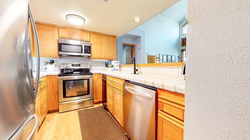 Condo, 2 Bedrooms | Private kitchen | Fridge, oven, coffee/tea maker, toaster