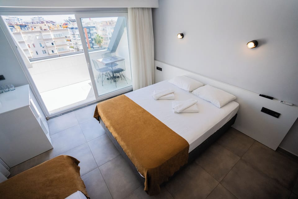 Standard Double or Twin Room, Partial Sea View | Minibar, desk, laptop workspace, free WiFi