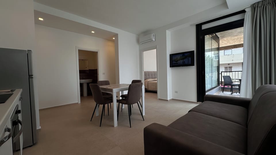 Deluxe Condo, 1 Queen Bed with Sofa bed, Garden View, Garden Area | Living area | Flat-screen TV