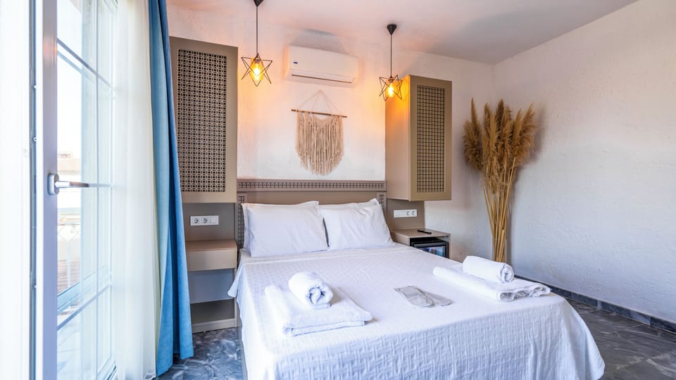 Deluxe Double Room, 1 Queen Bed, Balcony, Pool View | In-room safe, blackout drapes, soundproofing, iron/ironing board