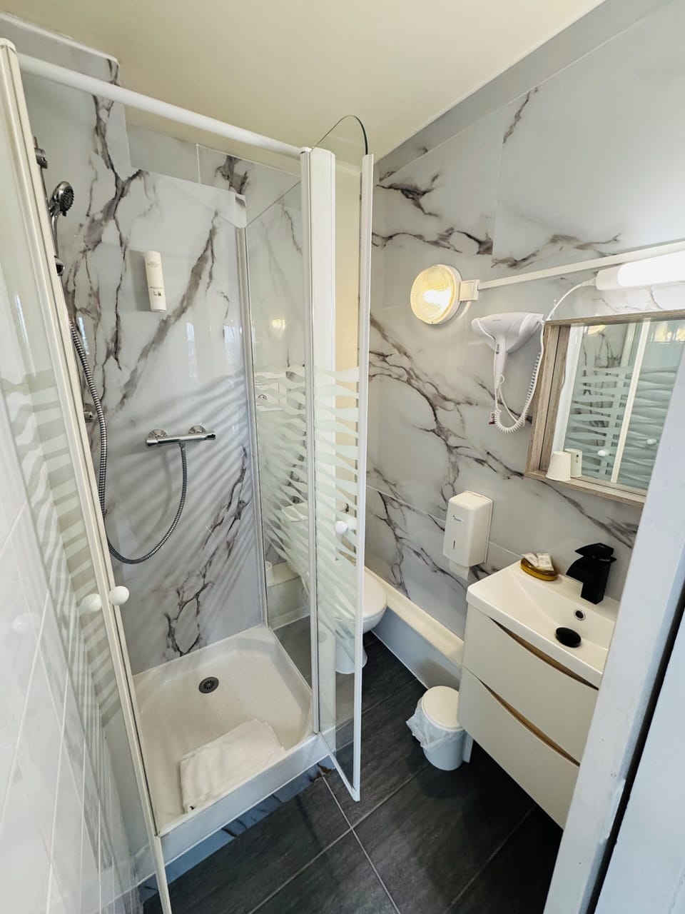 Shower, hair dryer, towels, soap
