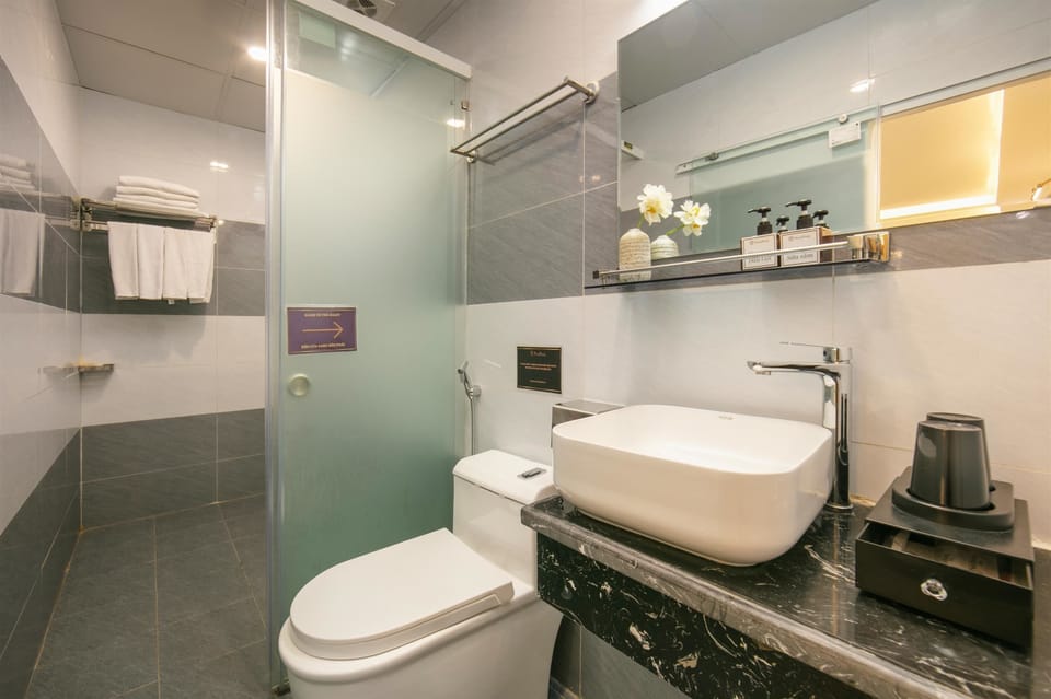 Luxury Quadruple Room, 2 Queen Beds, Non Smoking | Bathroom | Shower, hydromassage showerhead, designer toiletries, hair dryer