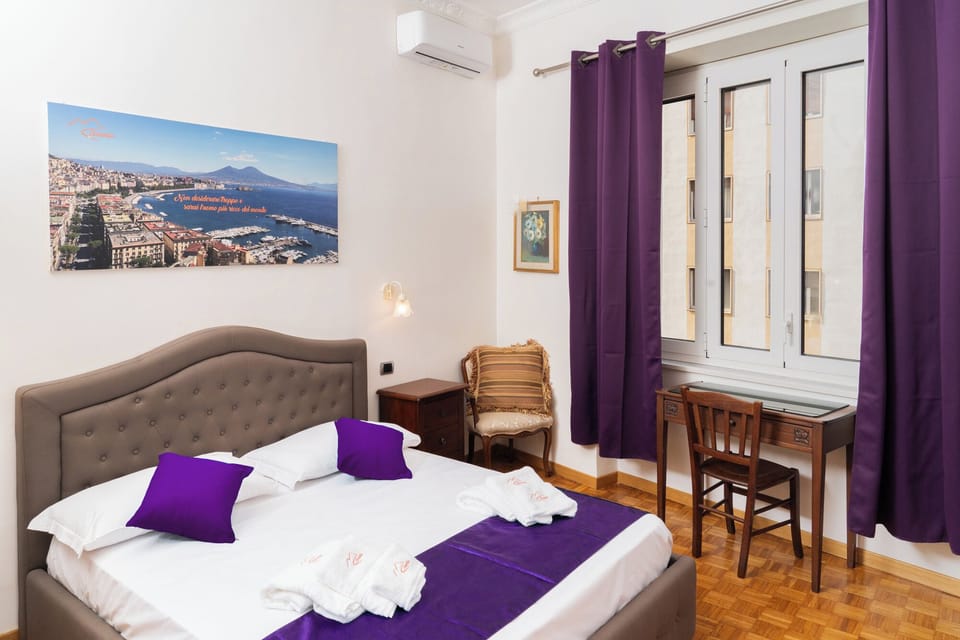 Deluxe Quadruple Room, City View | In-room safe, individually decorated, individually furnished, desk