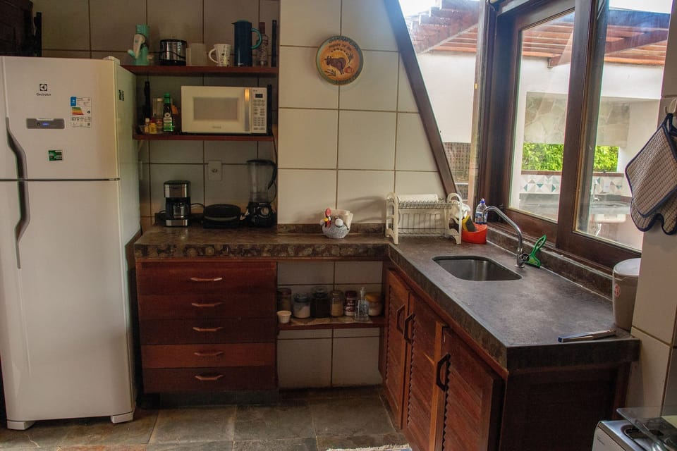 Villa | Private kitchen | Fridge, microwave, oven, blender