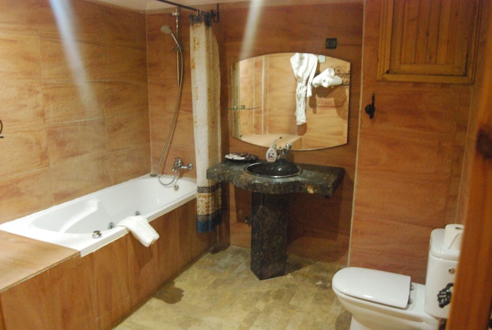 Economy Double Room, Pool View | Bathroom | Bathtub, hair dryer (on request), slippers, towels