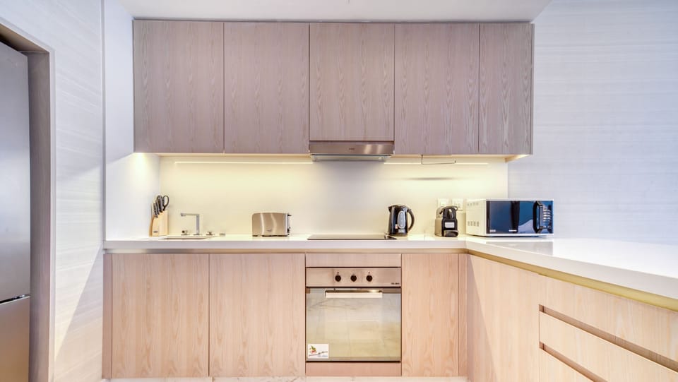 Deluxe Apartment, Sea View | Private kitchen | Full-size fridge, microwave, oven, coffee/tea maker