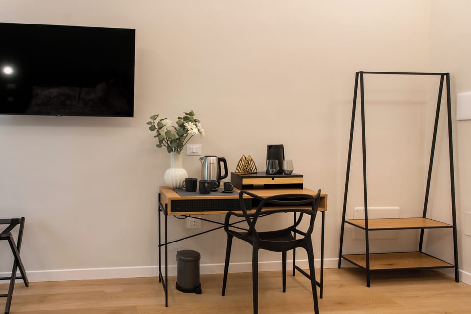 Deluxe Triple Room | Living area | 50-inch Smart TV with digital channels