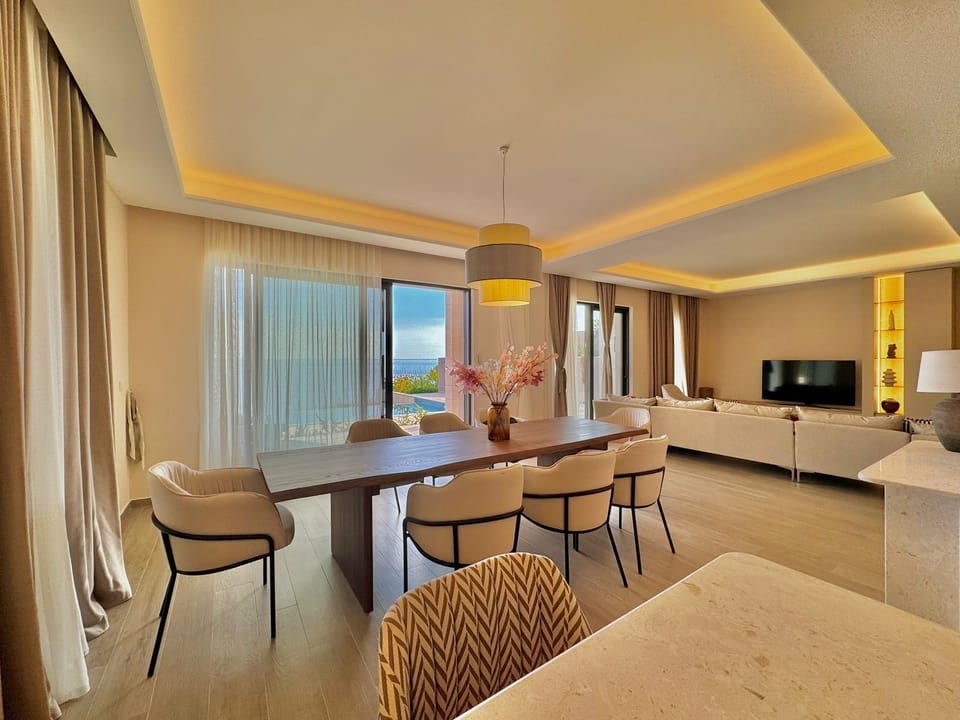 Luxury Apartment, Sea View | Living area | 50-inch LED TV with digital channels