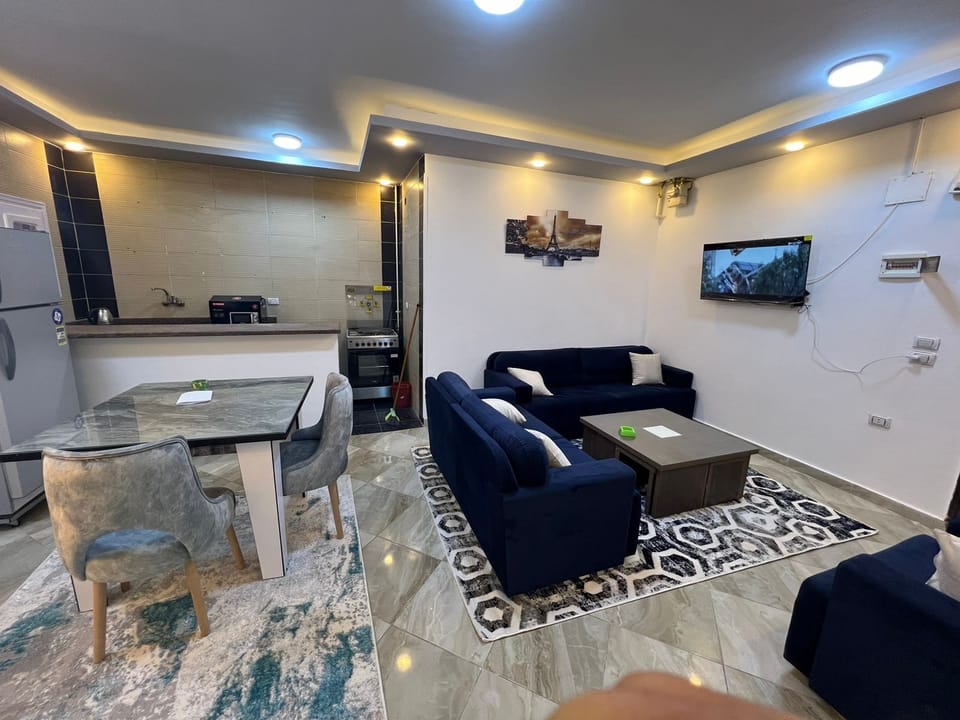 Comfort Apartment, Balcony, City View | Living area | Flat-screen TV