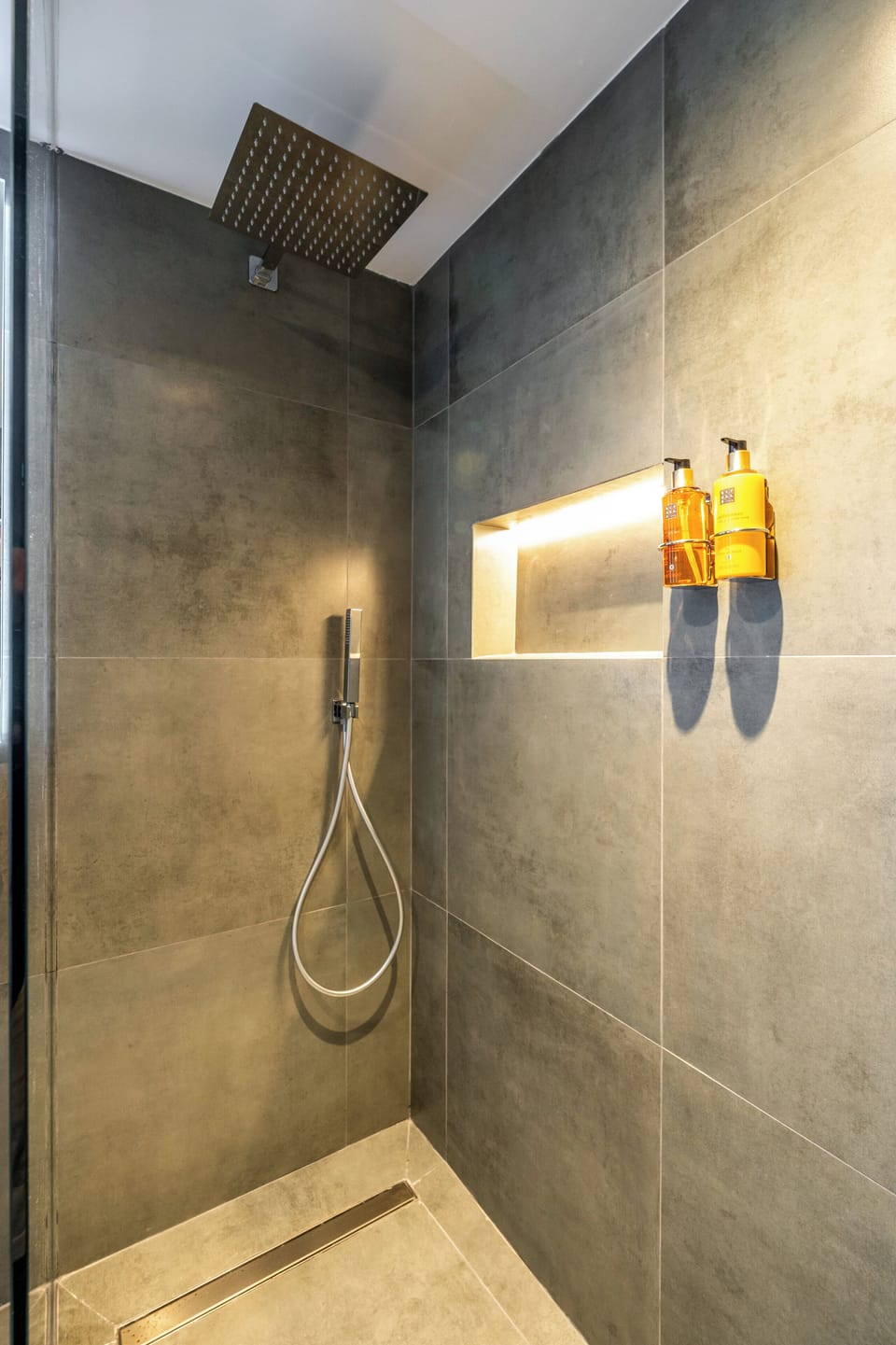Shower, designer toiletries, hair dryer, towels