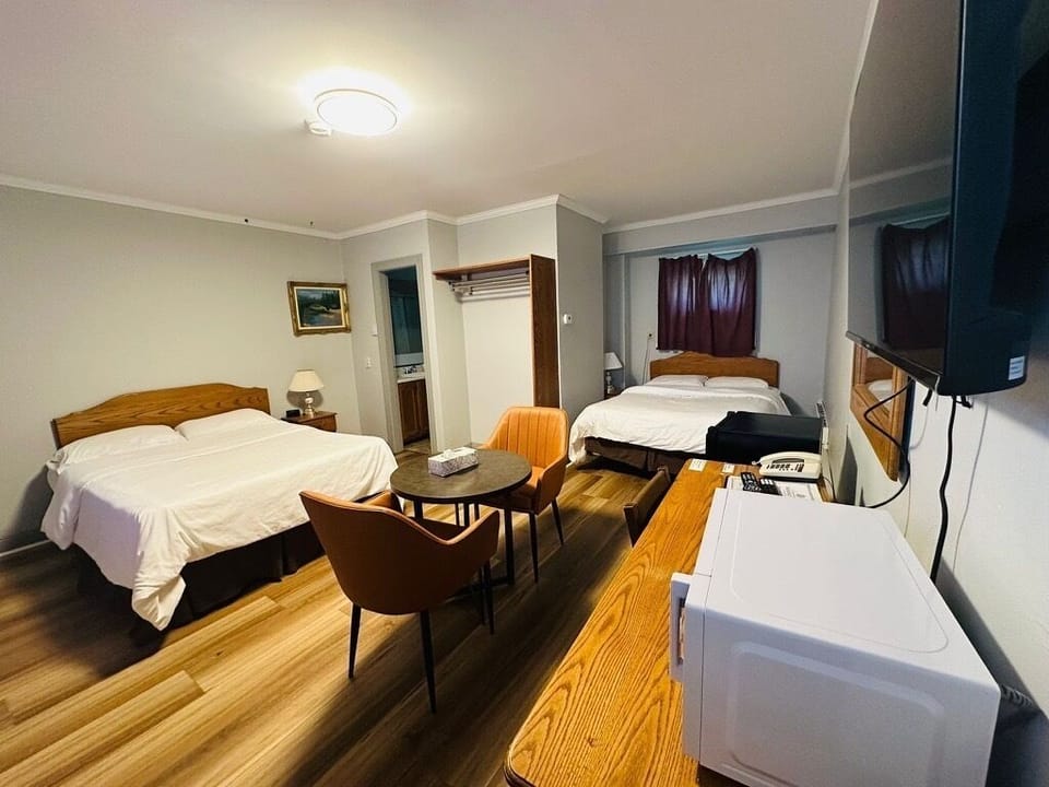 Room, 2 Queen Beds, Non Smoking | Desk, iron/ironing board, free WiFi, bed sheets