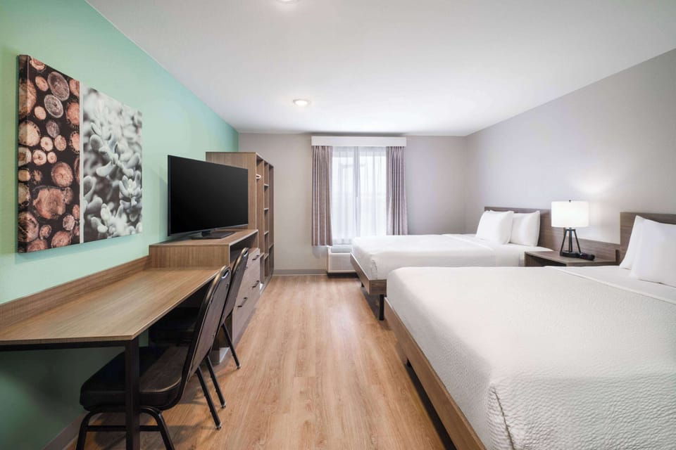 Suite, 2 Queen Beds, Non Smoking | Desk, laptop workspace, blackout drapes, free WiFi