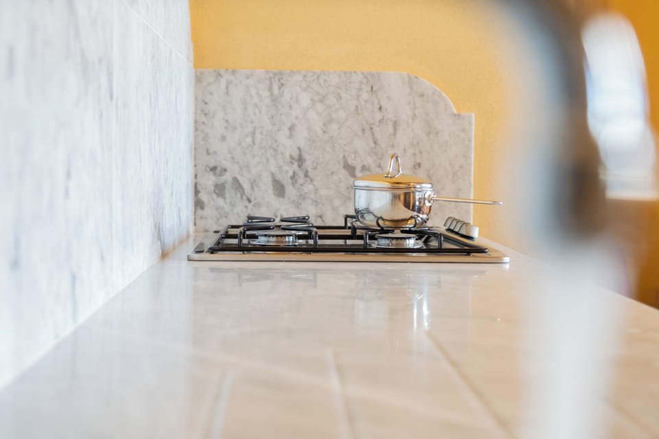 Studio Apartment | Private kitchen | Stovetop, dishwasher, toaster, highchair
