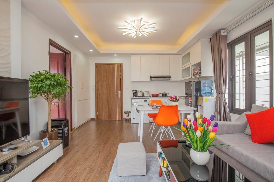 Business Apartment, Courtyard View | Living area | 55-inch TV with cable channels, fireplace, heated floors