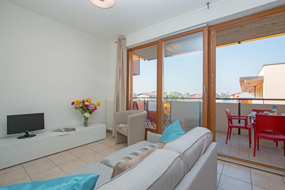 Condo, Pool View | Living area | 35-inch TV with digital channels