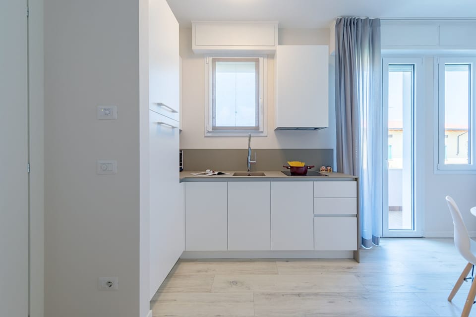 Apartment | Private kitchenette | Fridge, microwave, stovetop, dishwasher