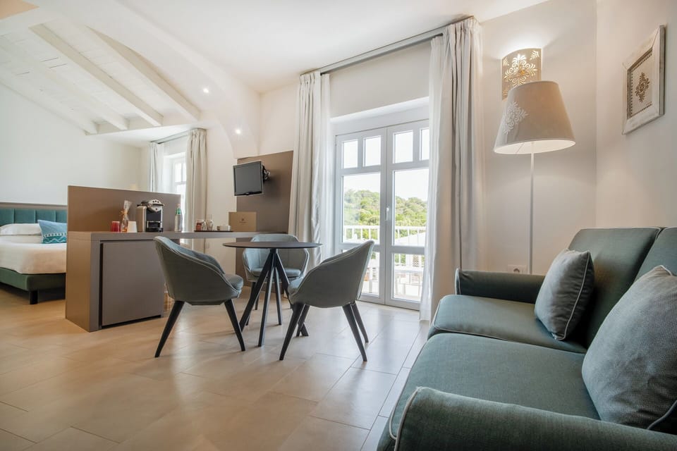 Junior Triple Room, 1 Bedroom, Balcony, Sea View | Minibar, desk, free WiFi, bed sheets