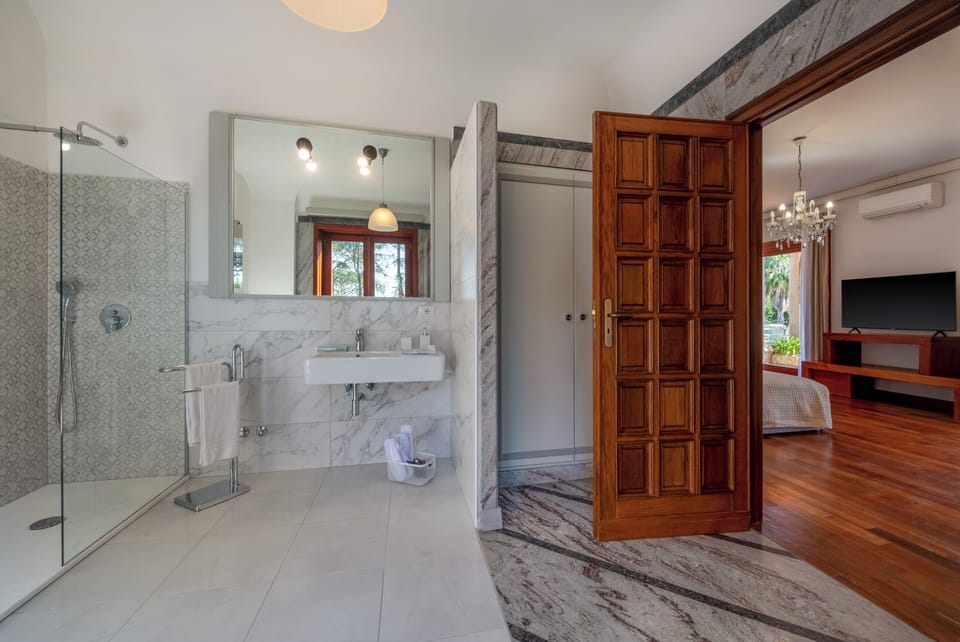 Superior Room, Partial Sea View | Bathroom | Shower, rainfall showerhead, hair dryer, slippers