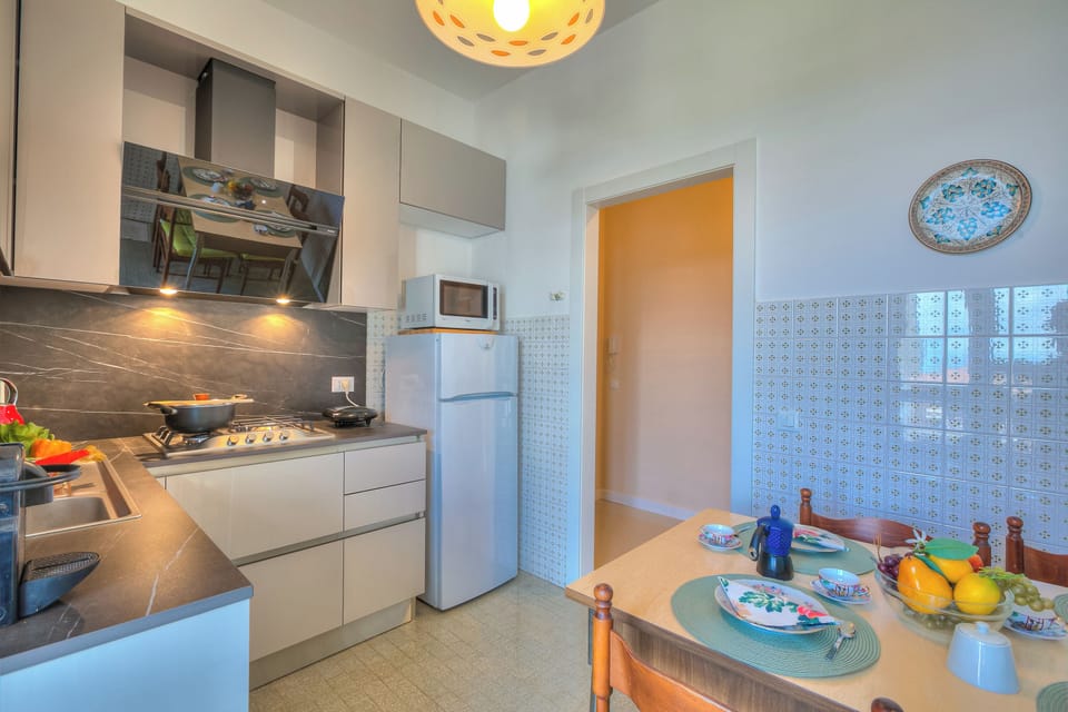 Family Apartment, 2 Bedrooms, Balcony (Casa Ferrari) | Private kitchen | Espresso maker