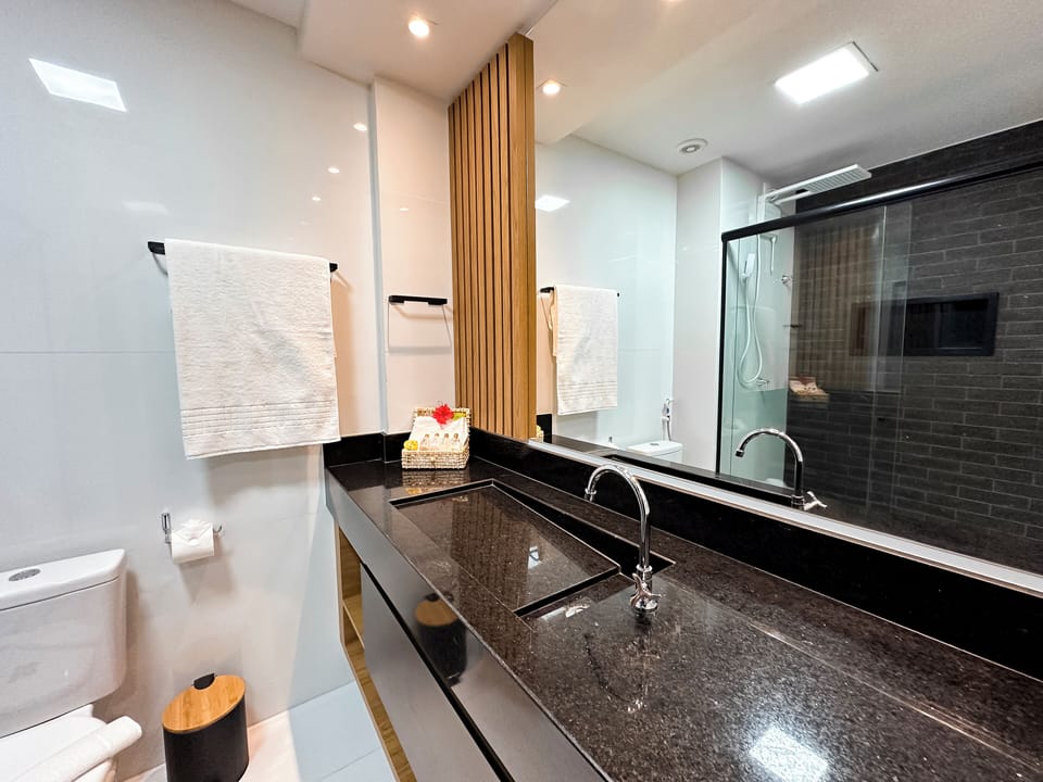 Comfort Room, Lanai | Bathroom | Shower, rainfall showerhead, hair dryer, towels