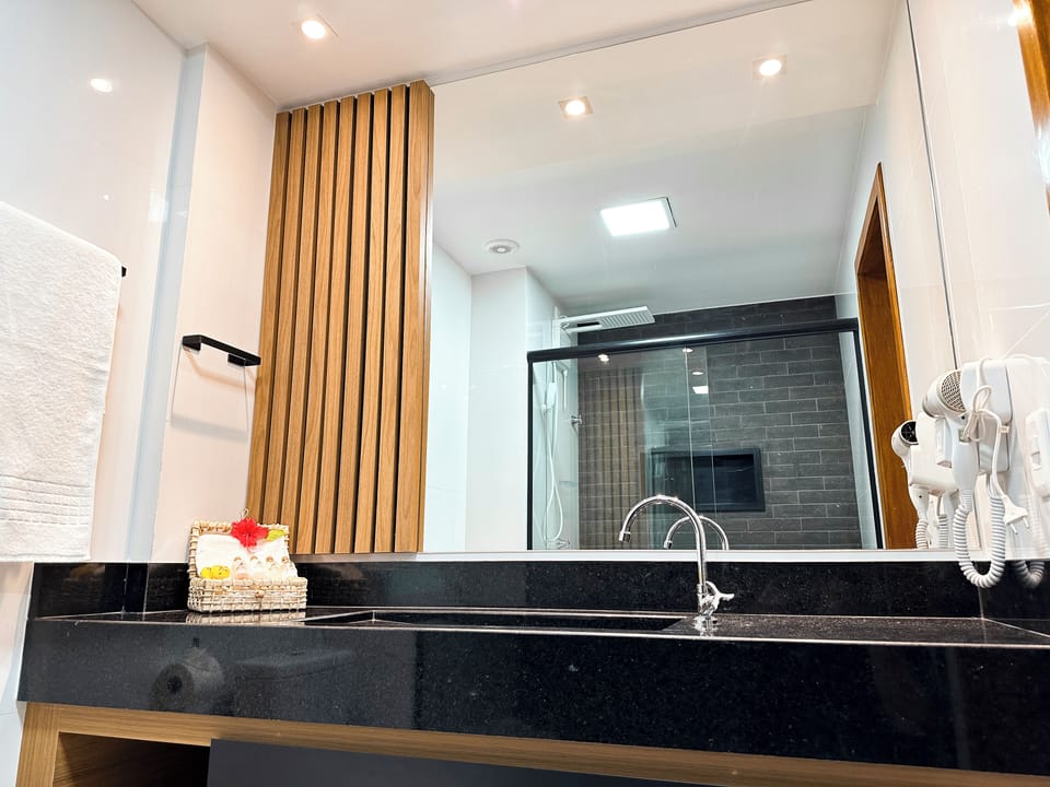 Comfort Room, Lanai | Bathroom | Shower, rainfall showerhead, hair dryer, towels