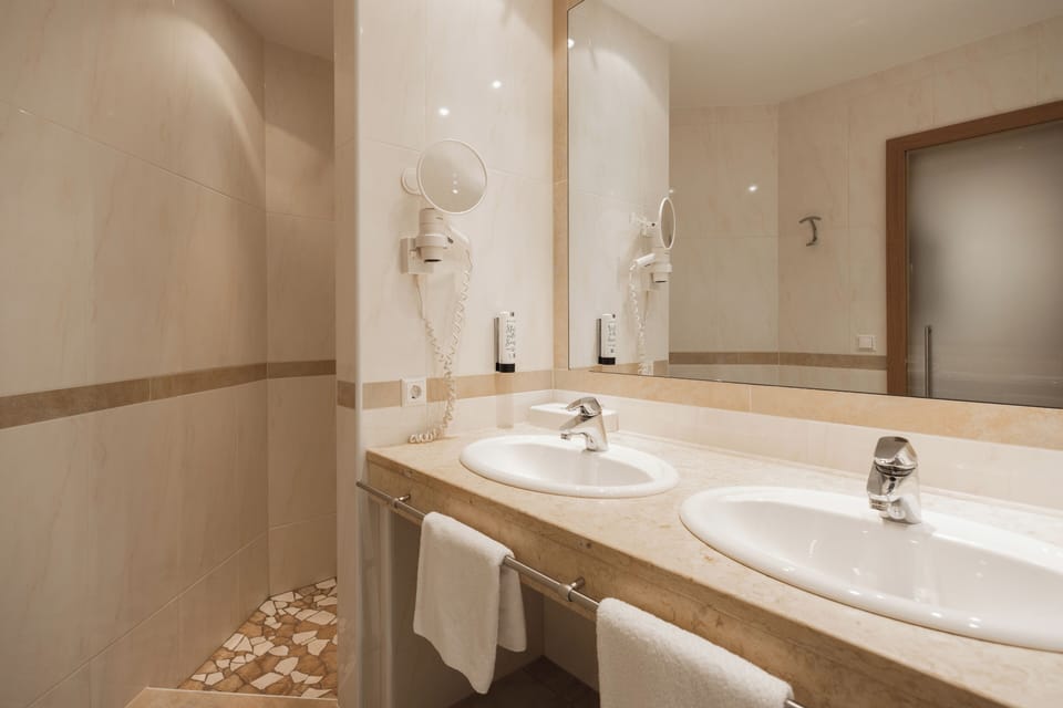 Duplex, Balcony, Mountain View | Bathroom | Hair dryer, bathrobes, towels