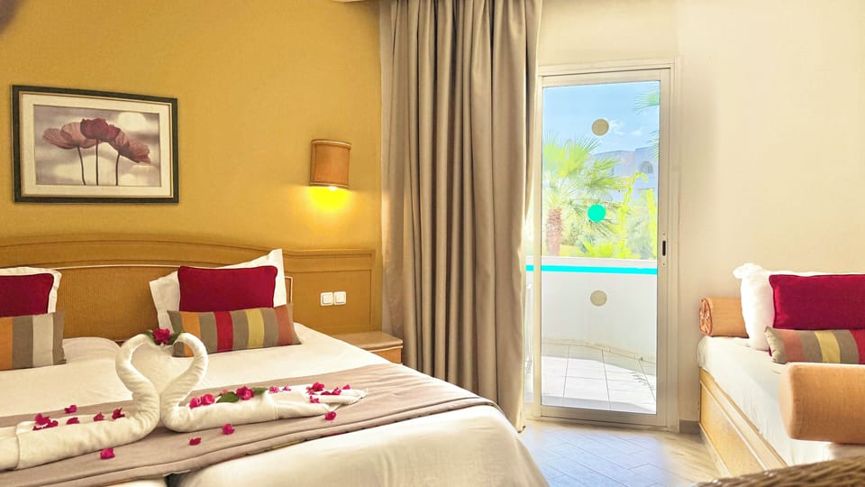 Standard Triple Room | Minibar, individually decorated, desk, laptop workspace