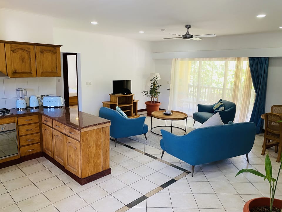 Family Apartment | Living area | 24-inch LED TV with cable channels, TV