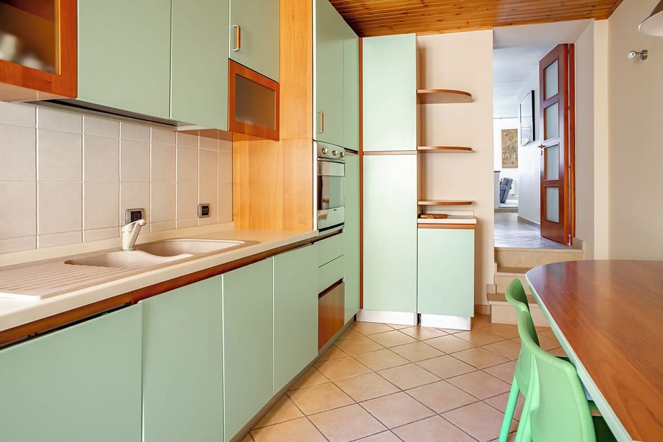 Apartment, Sea View | Private kitchen | Highchair, dining tables