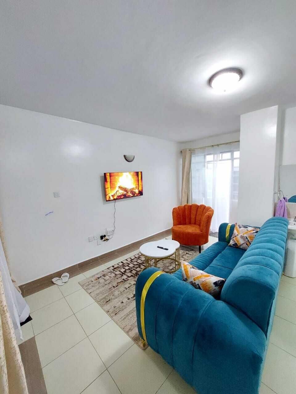 Deluxe Apartment, City View | Living area | 32-inch Smart TV with digital channels
