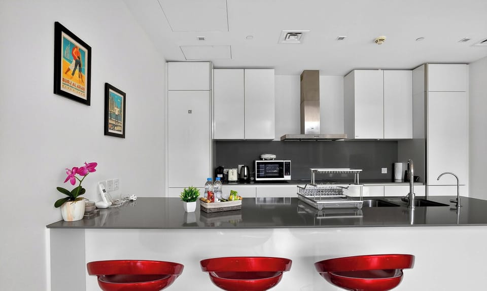 Luxury Apartment, Pool View | Private kitchen | Fridge, microwave, oven, stovetop