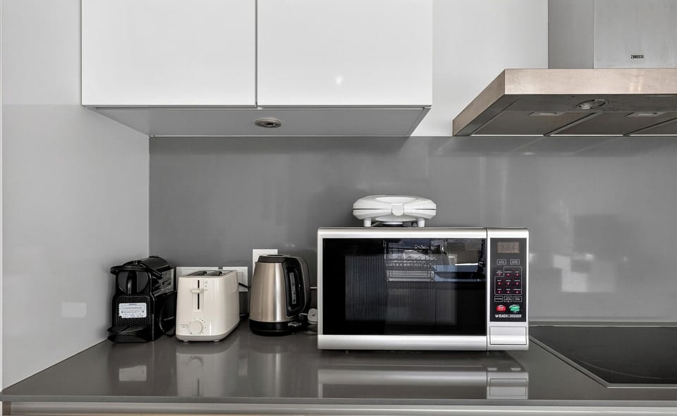 Luxury Apartment, Pool View | Private kitchen | Fridge, microwave, oven, stovetop