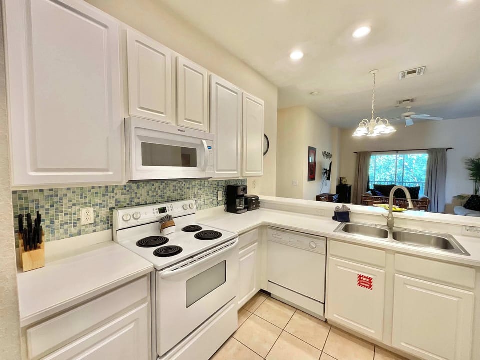 Condo, Multiple Beds, Pool Access, Garden View (Charming Villa at Bahama Bay) | Private kitchen | Coffee/tea maker