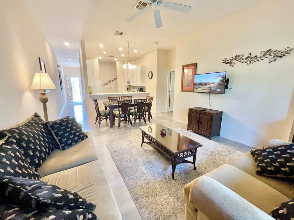 Condo, Multiple Beds, Pool Access, Garden View (Charming Villa at Bahama Bay) | Living area | 42-inch flat-screen TV with digital channels