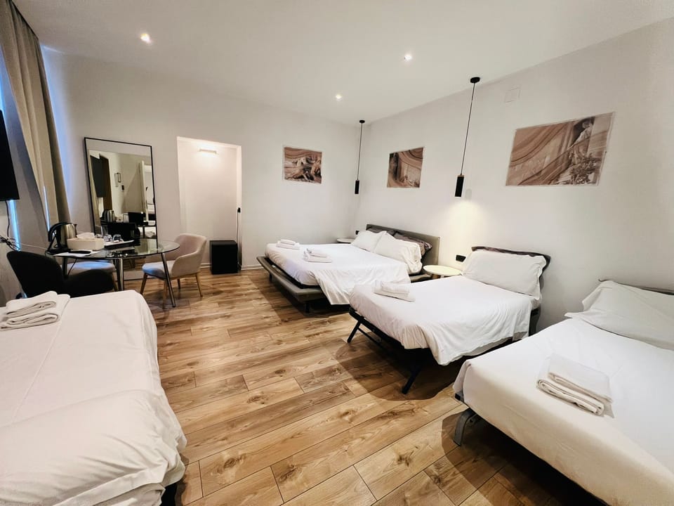 Deluxe Quadruple Room | In-room safe, blackout drapes, soundproofing, iron/ironing board