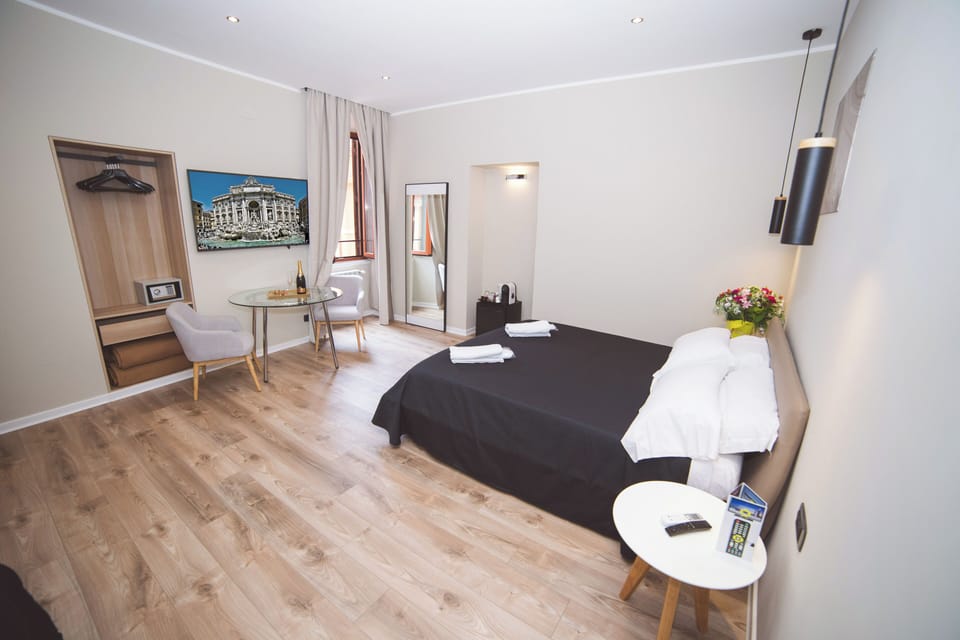 Deluxe Quadruple Room | In-room safe, blackout drapes, soundproofing, iron/ironing board