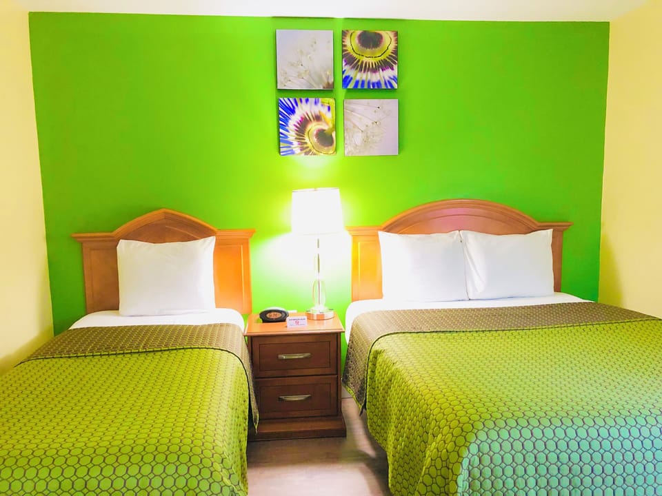 two room suite with 1 Queen Bed, 1 Twin Bed and 1 Sofa Bed | 1 bedroom, desk, laptop workspace, iron/ironing board
