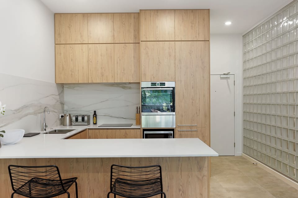 Two Bedroom Apartment with Parking | Private kitchen | Coffee/tea maker, toaster, dining tables