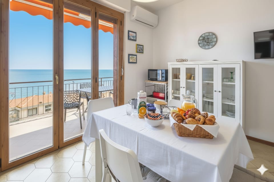 Basic Apartment, Sea View | Living area | Flat-screen TV