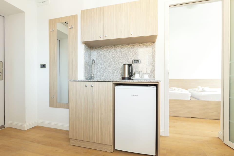 Classic Studio Suite, 2 Bedrooms, Non Smoking, City View | Private kitchen | Fridge, electric kettle, paper towels, kitchen islands