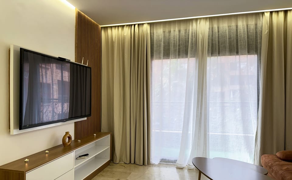 Design Apartment | Living area | 60-inch Smart TV with satellite channels, Netflix, pay movies