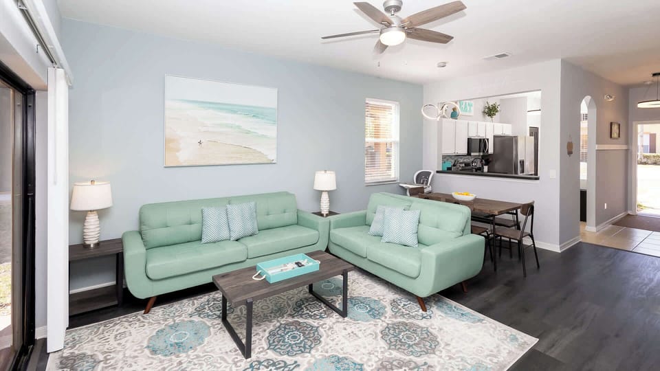 Townhome, Multiple Beds, Pool Access, Garden View (Just Beachy at Regal Palms) | Living area | 42-inch flat-screen TV with digital channels